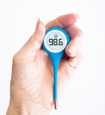 Hand holding the Kinsa QuickCare thermometer